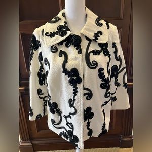 Lena Gabrielle of NY jacket size 10 white crepe fabric w/black ribbon detailing.